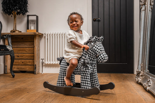 Dazzle & Jet Rocking Horse (9m+) by Little Bird Told Me — child enjoying the rocker