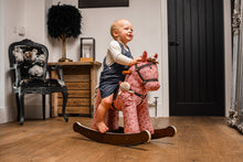 Cooper & Beau Rocking Horse (12m+) by Little Bird Told Me — child enjoying the rocker