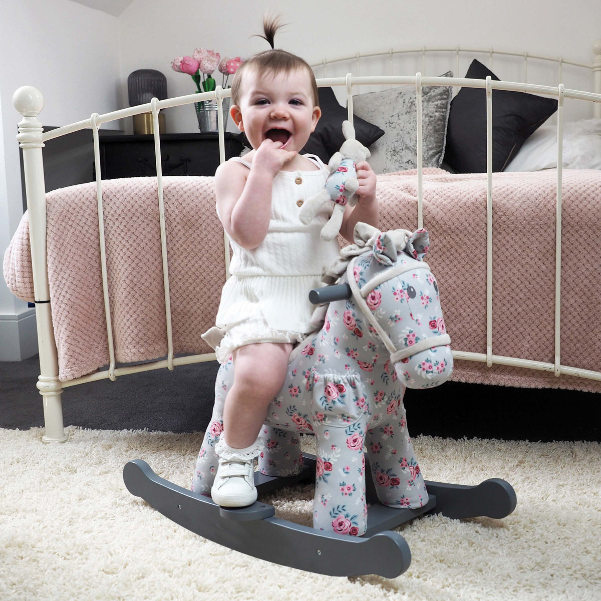 Child enjoying a Lily and Rose rocking horse